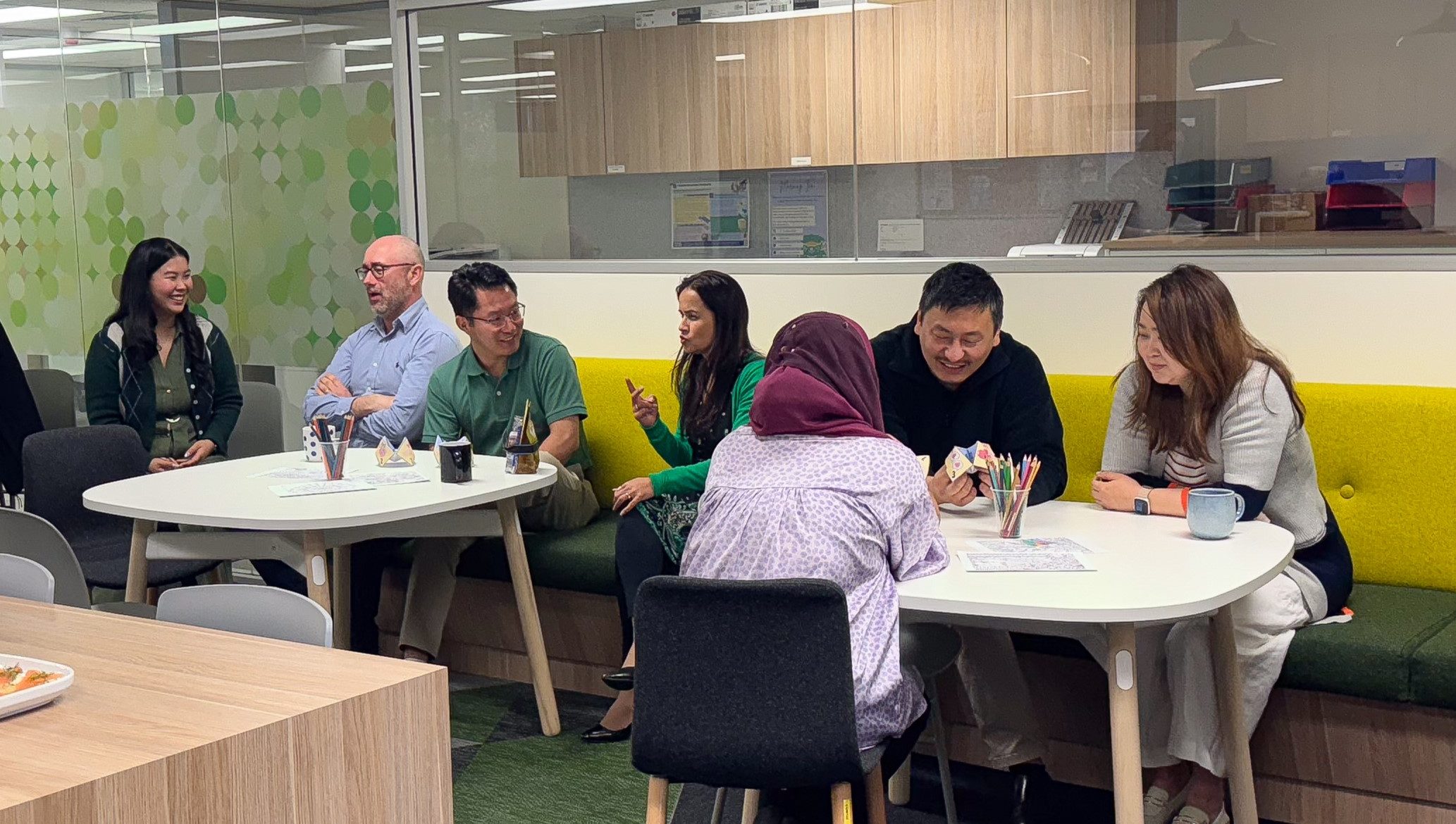 An image of 7 ACT Leave staff members chatting during a morning tea