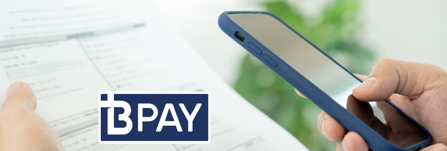 An image of somebody holding a bill and their smartphone, and the BPay logo